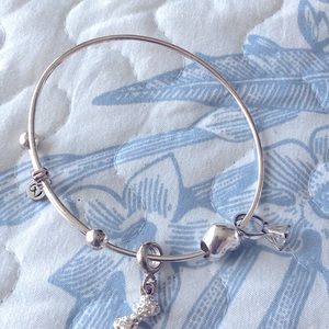 Charms Bracelet Expandable with 3 charms Maker’s marks. No metal content stamps.